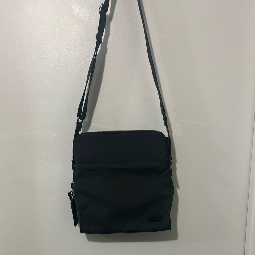 Authentic black Tumi canvas bag ideal for tablets.
